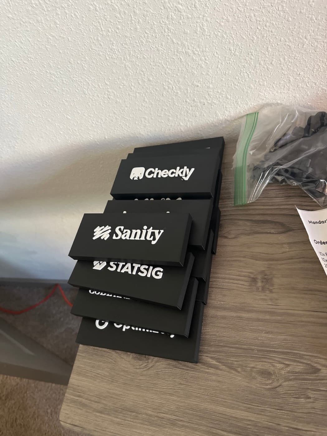 A batch of custom nameplates, one per person